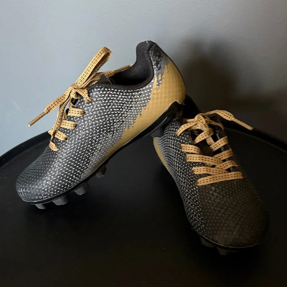 DSG size 10 Black and Gold Soccer Cleats